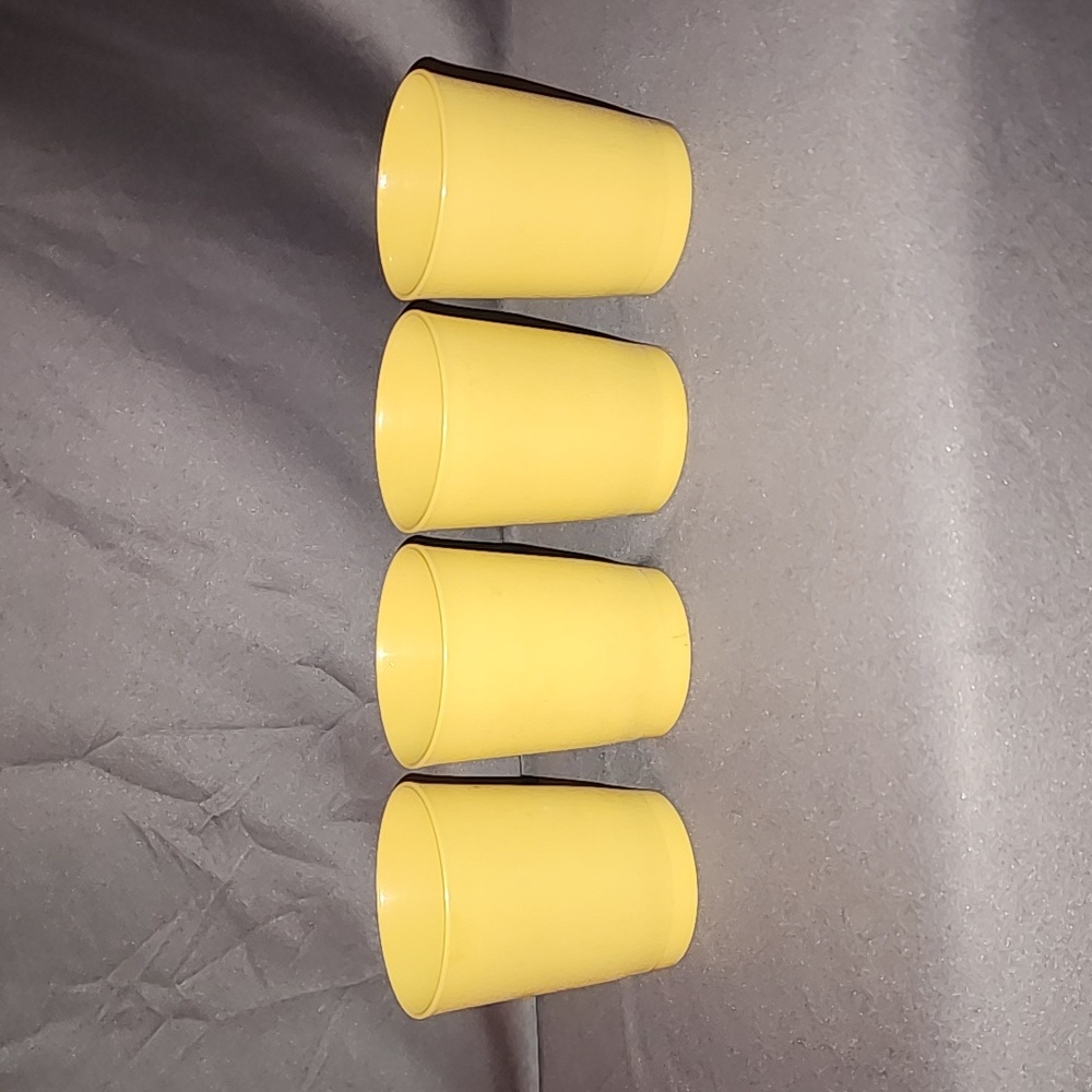 Four Tupperware Tumblers - holds 4 ounces, dull, yellow color